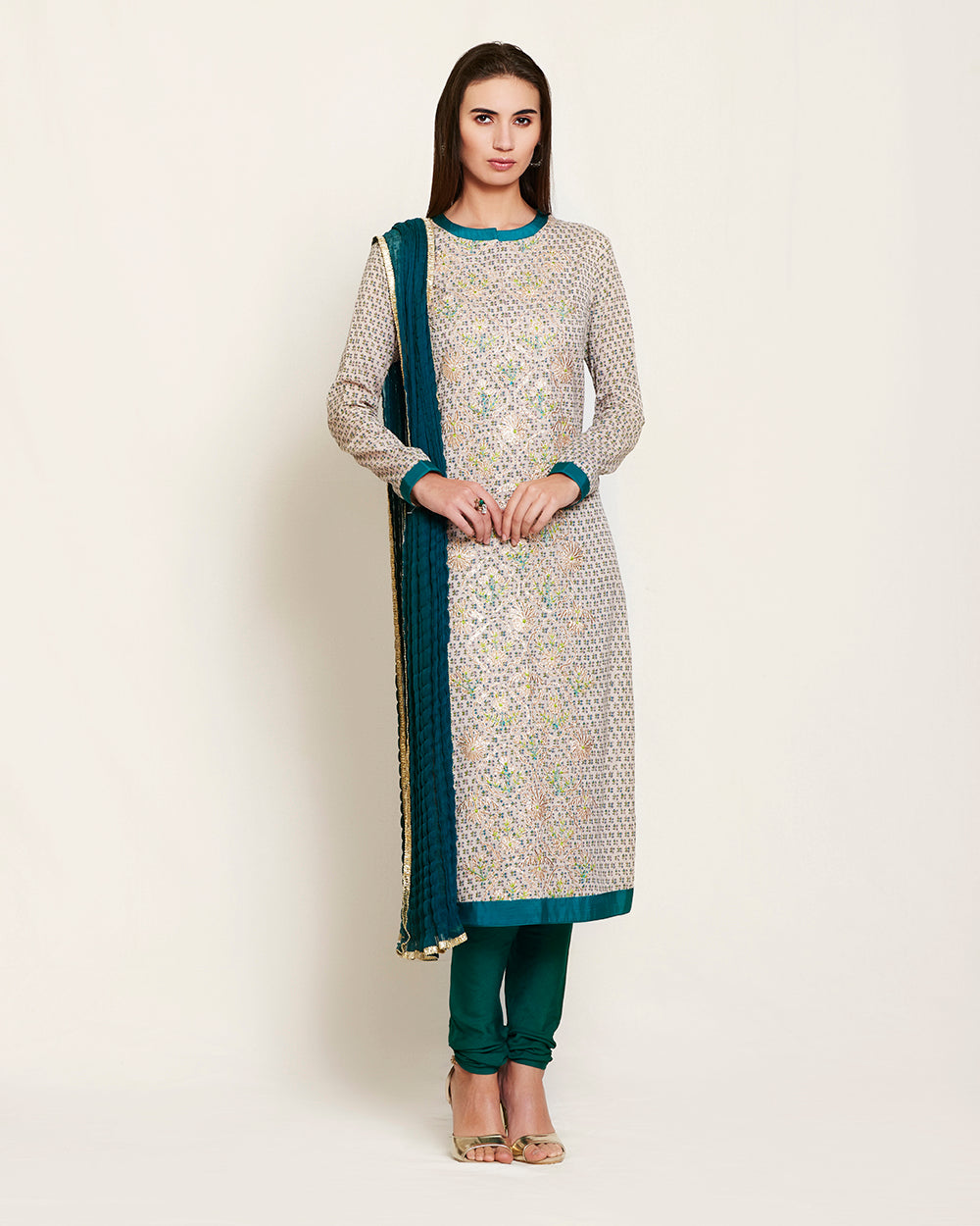 Neutral/teal kurta set.
