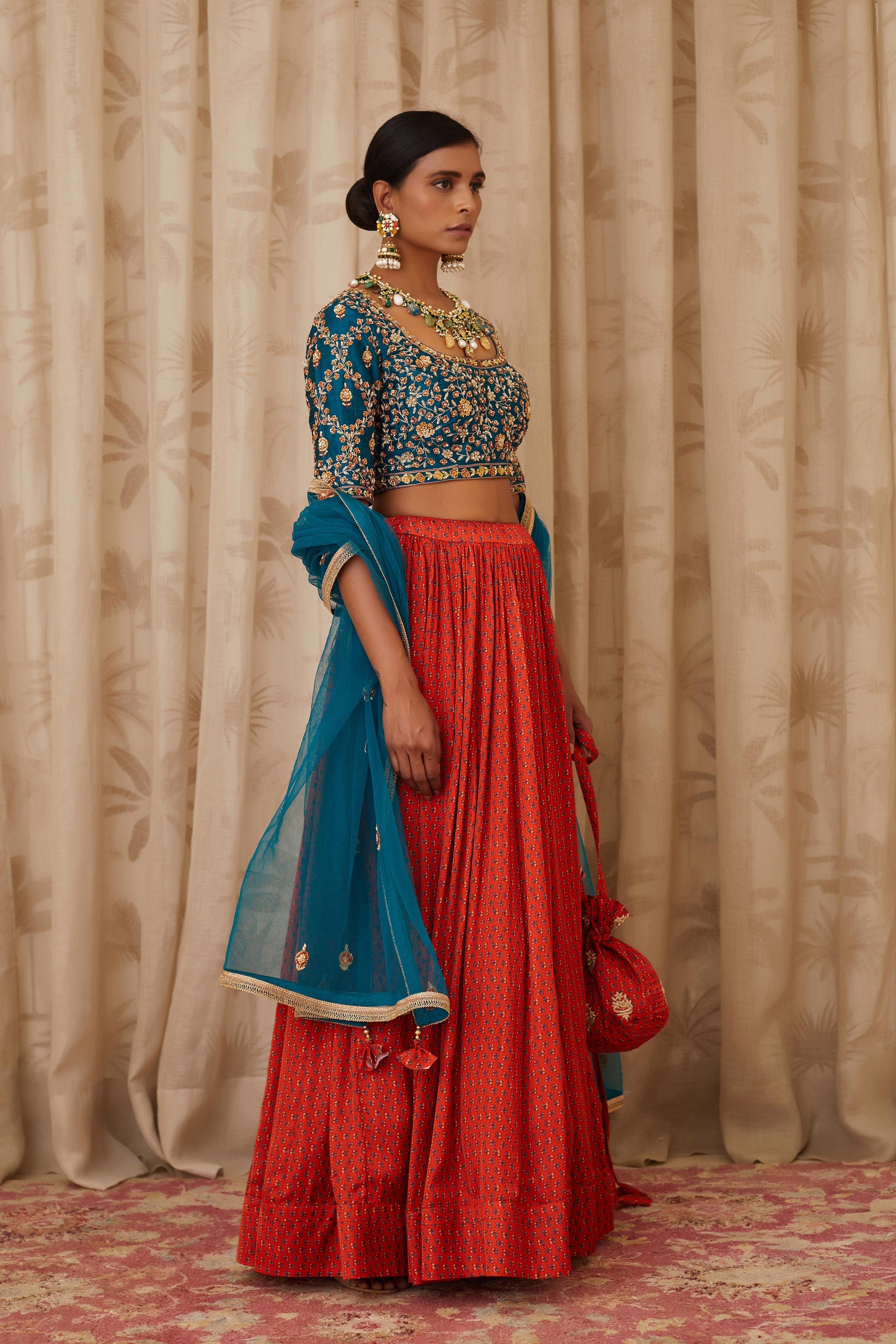 Teal Blue and Burnt Orange Lehenga Set.